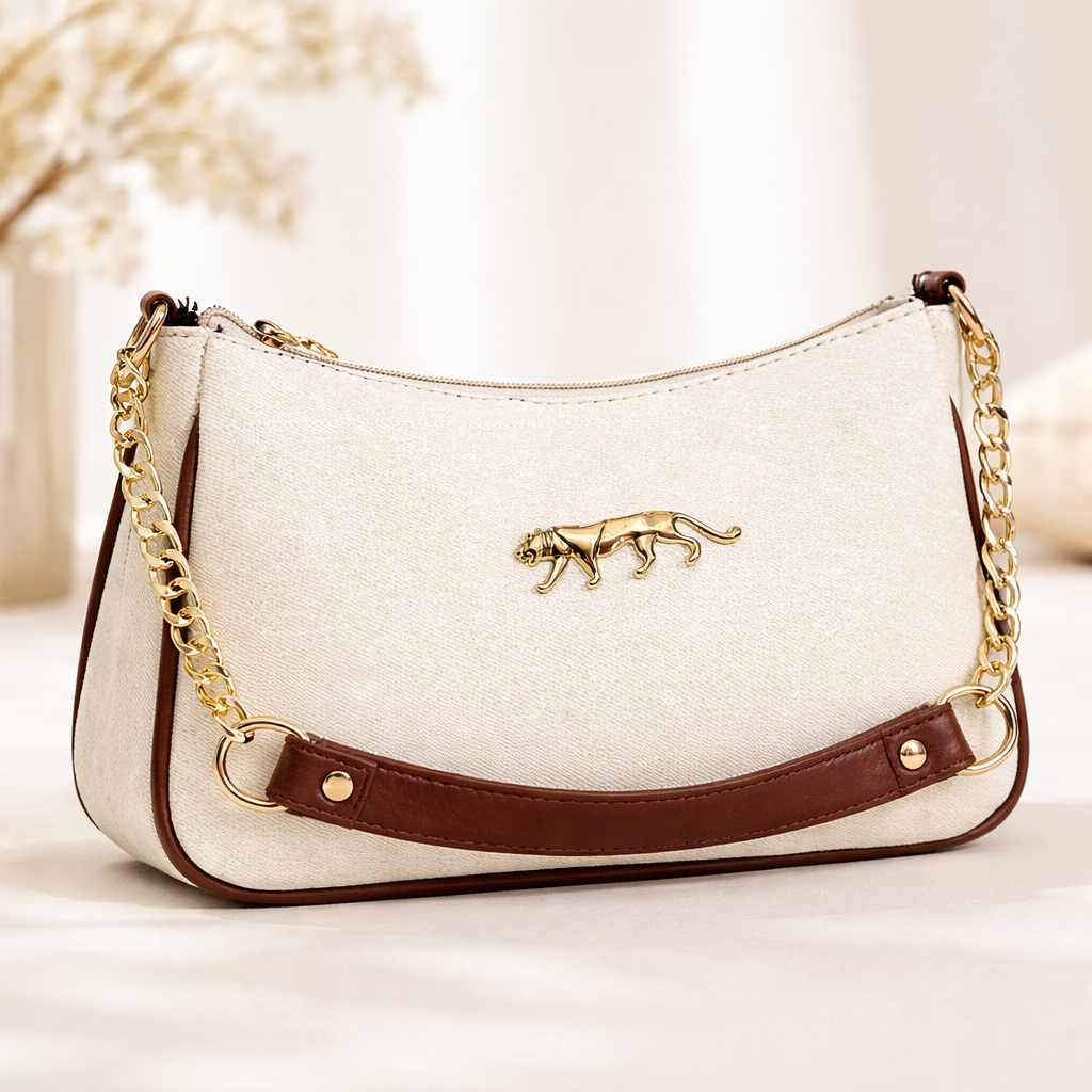 Sabyasachi Firpo Pochette signature gold-tone Bengal tiger emblem and a chain sling-Crème